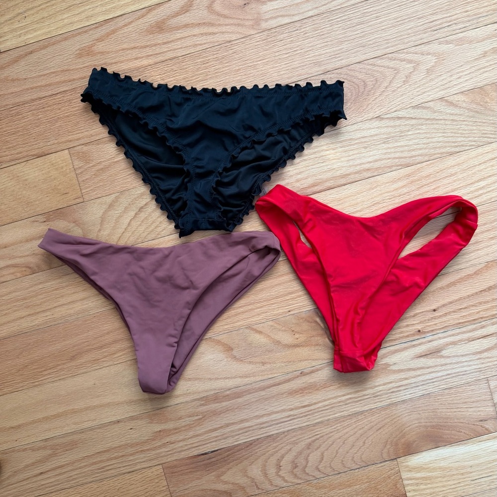 Set of Three Women's swimwear Bikini Panties - Black, Red, and pinkish.